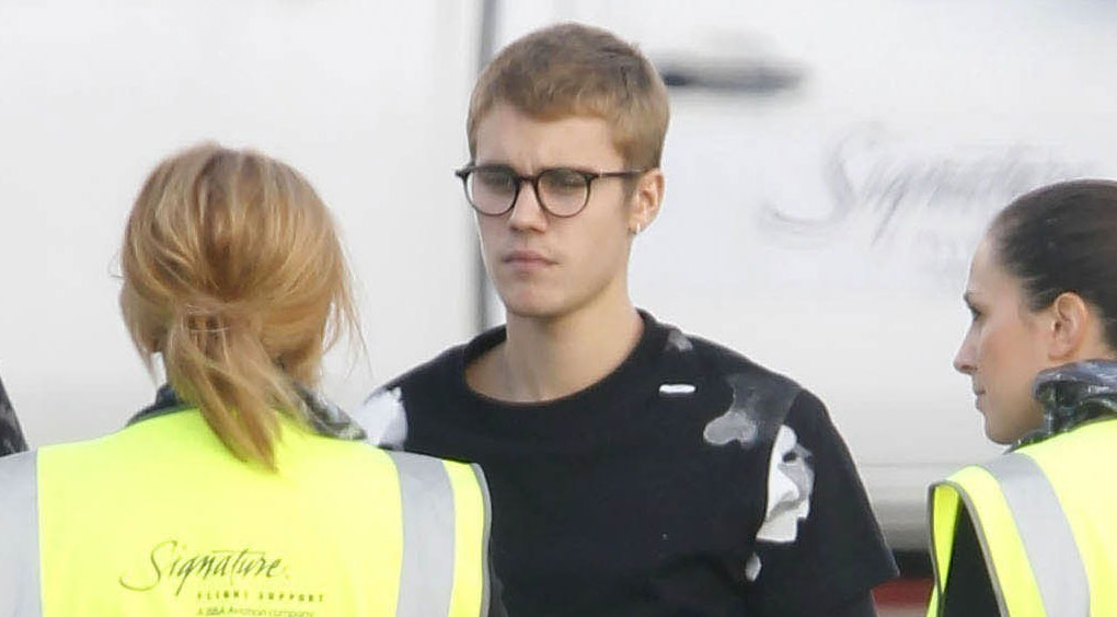 Justin Bieber Travels With 'Occupy All Streets' Book in England
